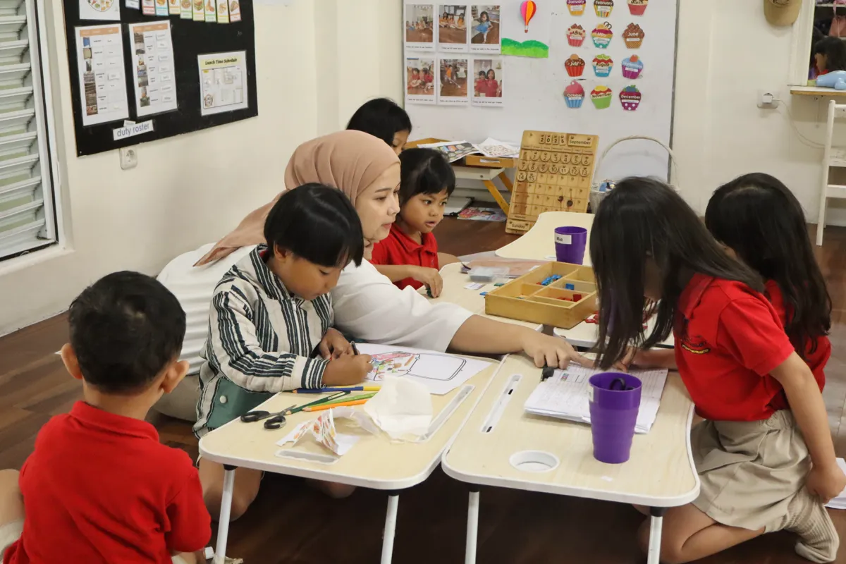Children taking part in everyday learning activities at Pascal Montessori